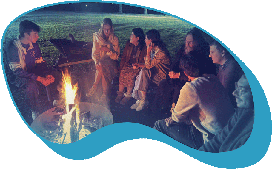 People gathered around campfire